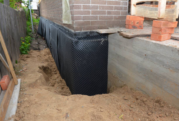 SJ Waterproofing Pros technician performing targeted Exterior Waterproofing assessment in Butler, AL